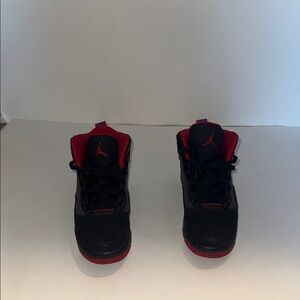 Jordan Black and Red High-Top Sneakers with Bold Accents